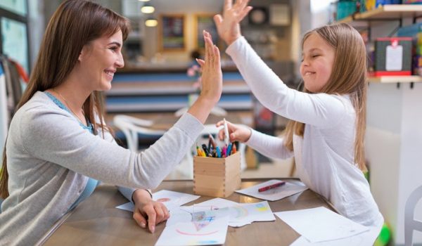 Mother and daughter having good time, smiling